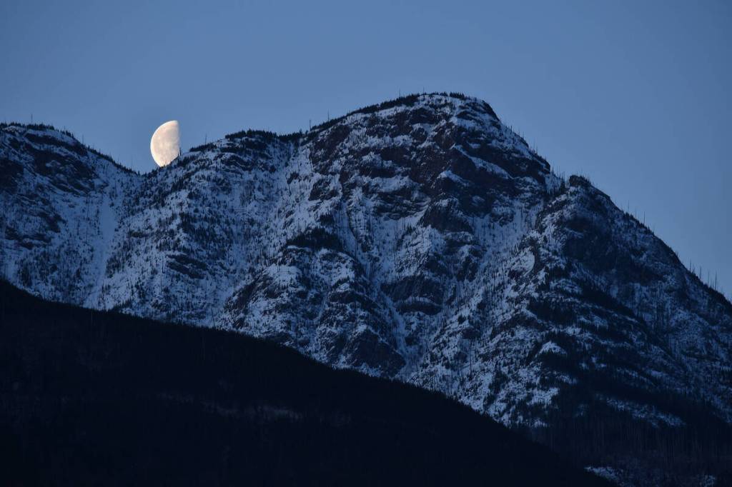 The moon makes a momentary appearance behind Salmon Arm&rsquo;s Mount Ida on Tuesday morning, March 10, 2026. (Lachlan Labere-Salmon Arm Observer)